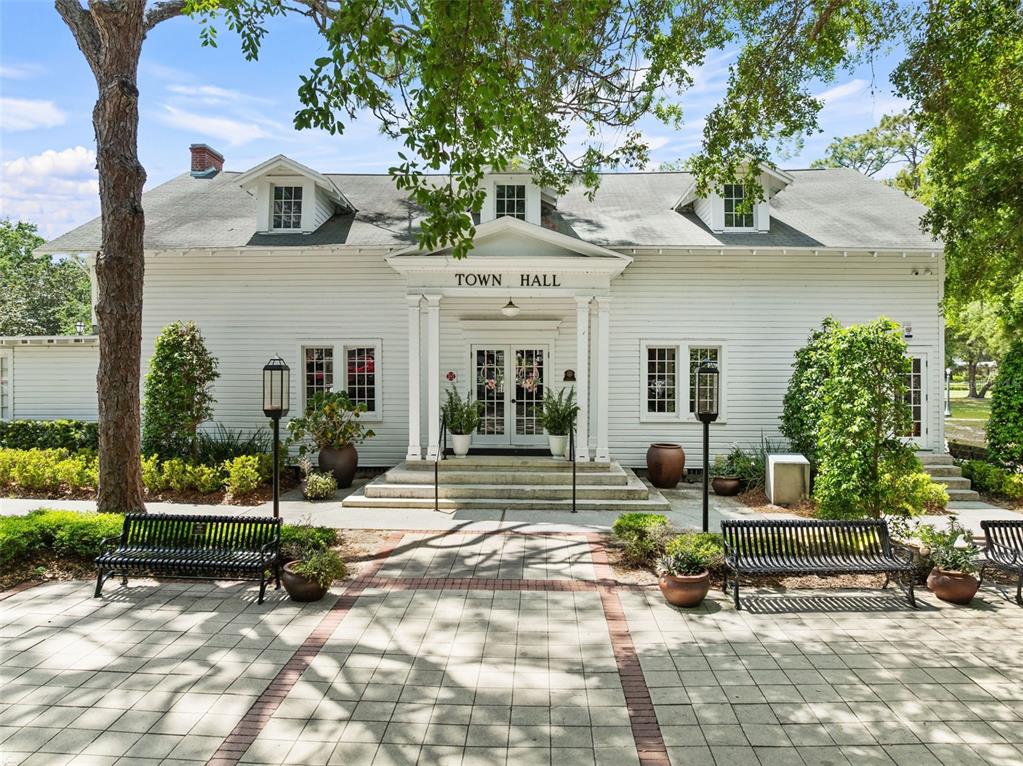 13137 Lake Butler Boulevard Windermere, FL 34786 - Photo 94 of 98 a view of a house with backyard porch and sitting area