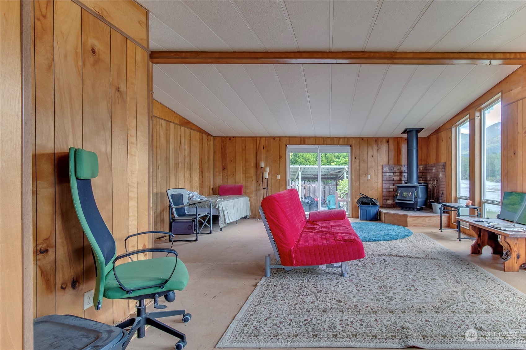 140 Maple Place Packwood, WA 98361 - Photo 11 of 39 a living room with furniture a rug and a large window