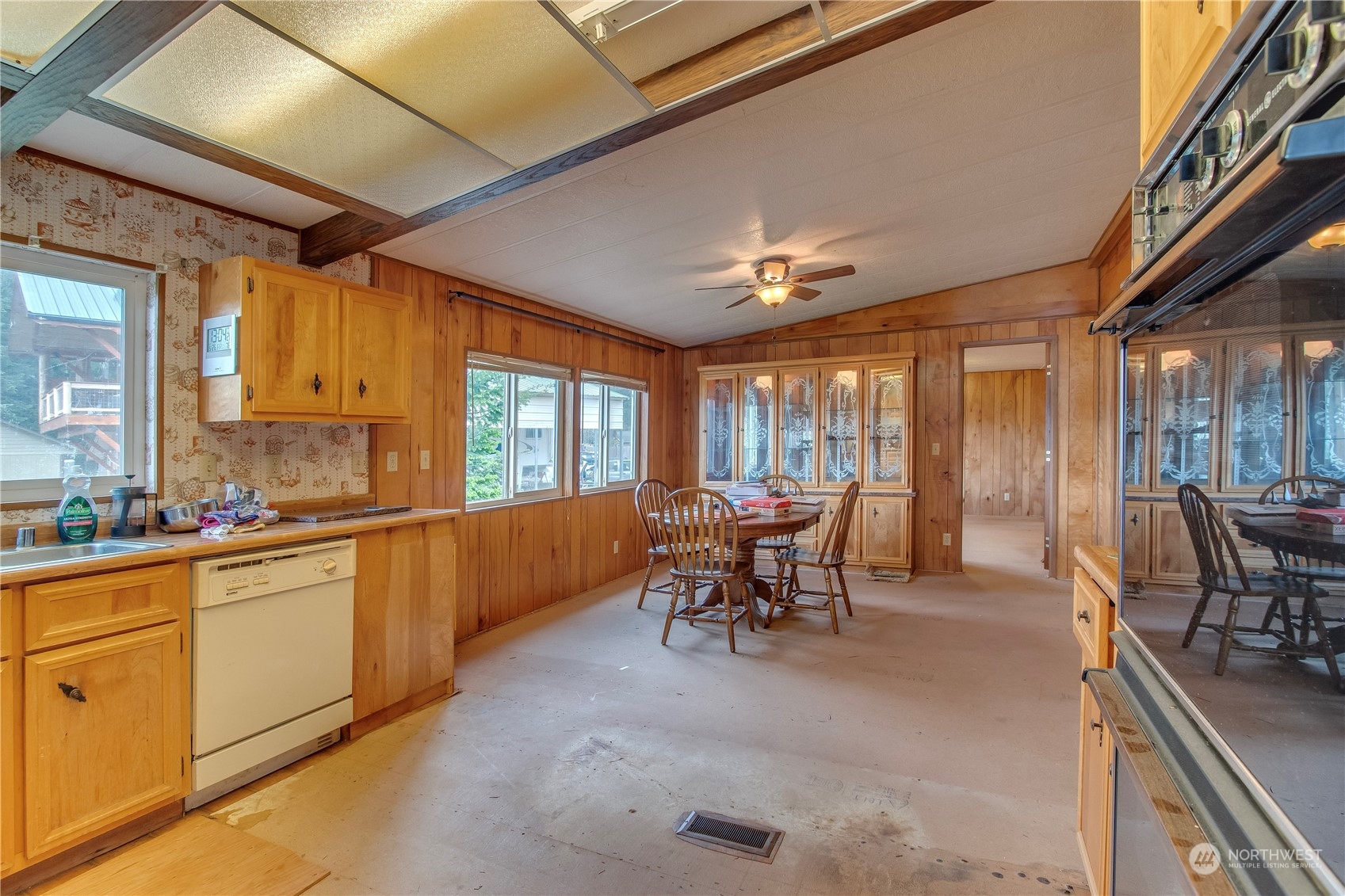 140 Maple Place Packwood, WA 98361 - Photo 16 of 39 a large kitchen with a table and chairs
