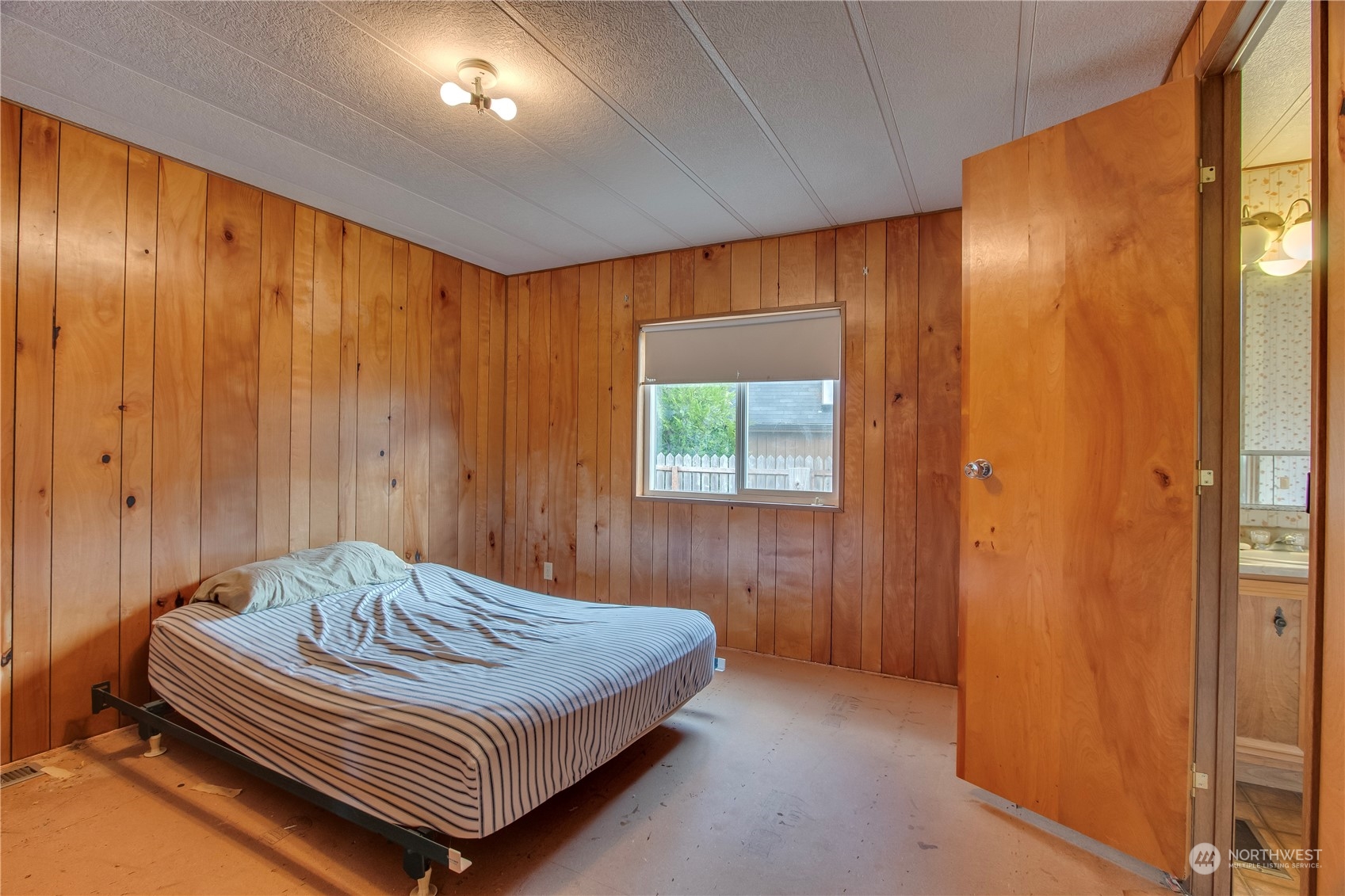 140 Maple Place Packwood, WA 98361 - Photo 26 of 39 a bedroom with a bed and a window