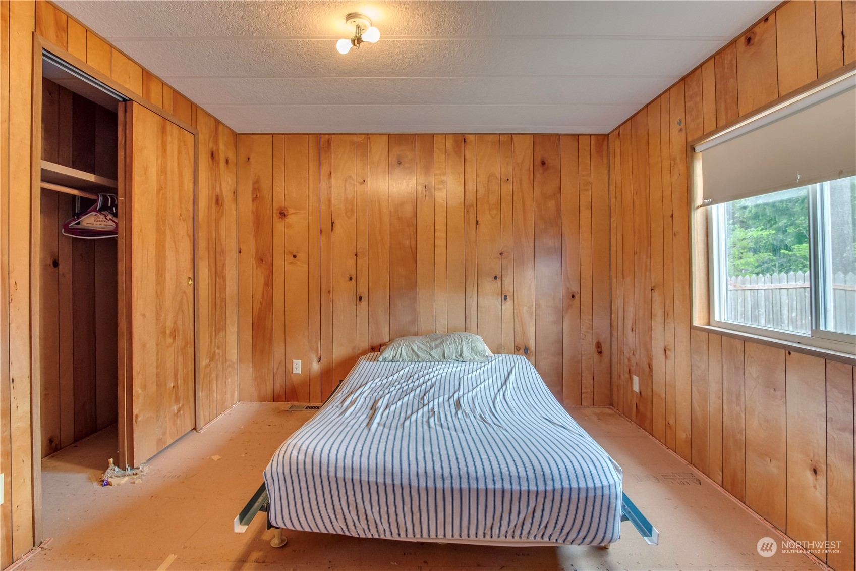 140 Maple Place Packwood, WA 98361 - Photo 27 of 39 a bedroom with a bed and a window