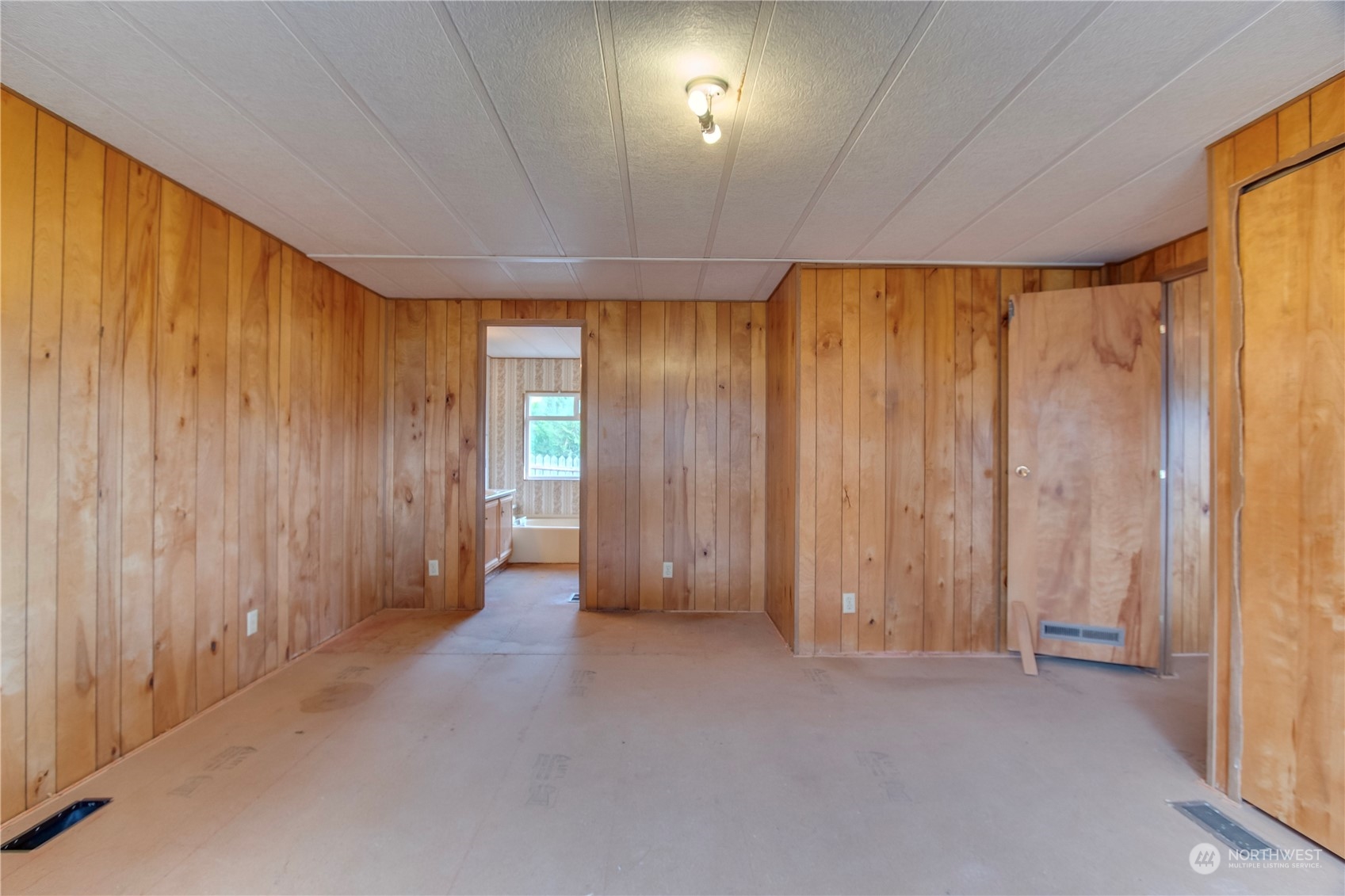 140 Maple Place Packwood, WA 98361 - Photo 30 of 39 a view of room with a wooden door
