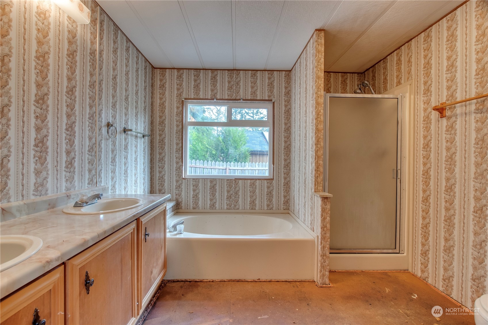 140 Maple Place Packwood, WA 98361 - Photo 31 of 39 a bathroom with a granite countertop tub sink and mirror