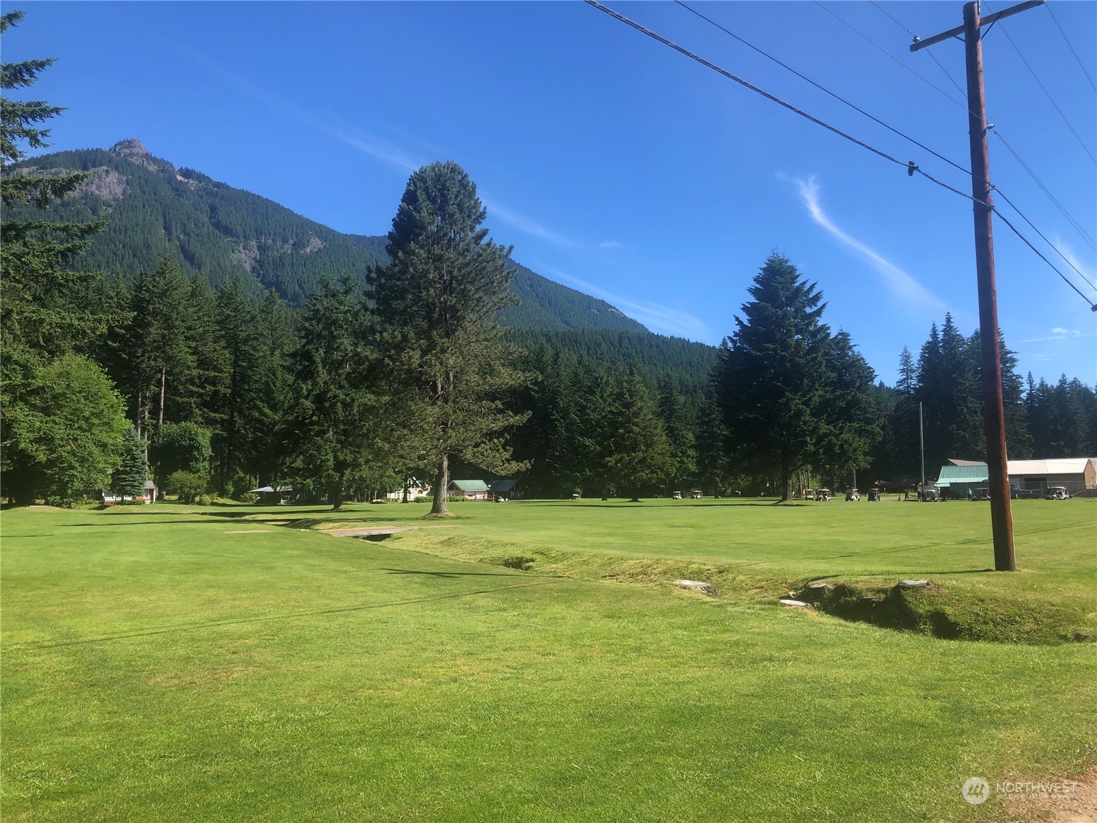 140 Maple Place Packwood, WA 98361 - Photo 37 of 39 a view of a golf course with a house