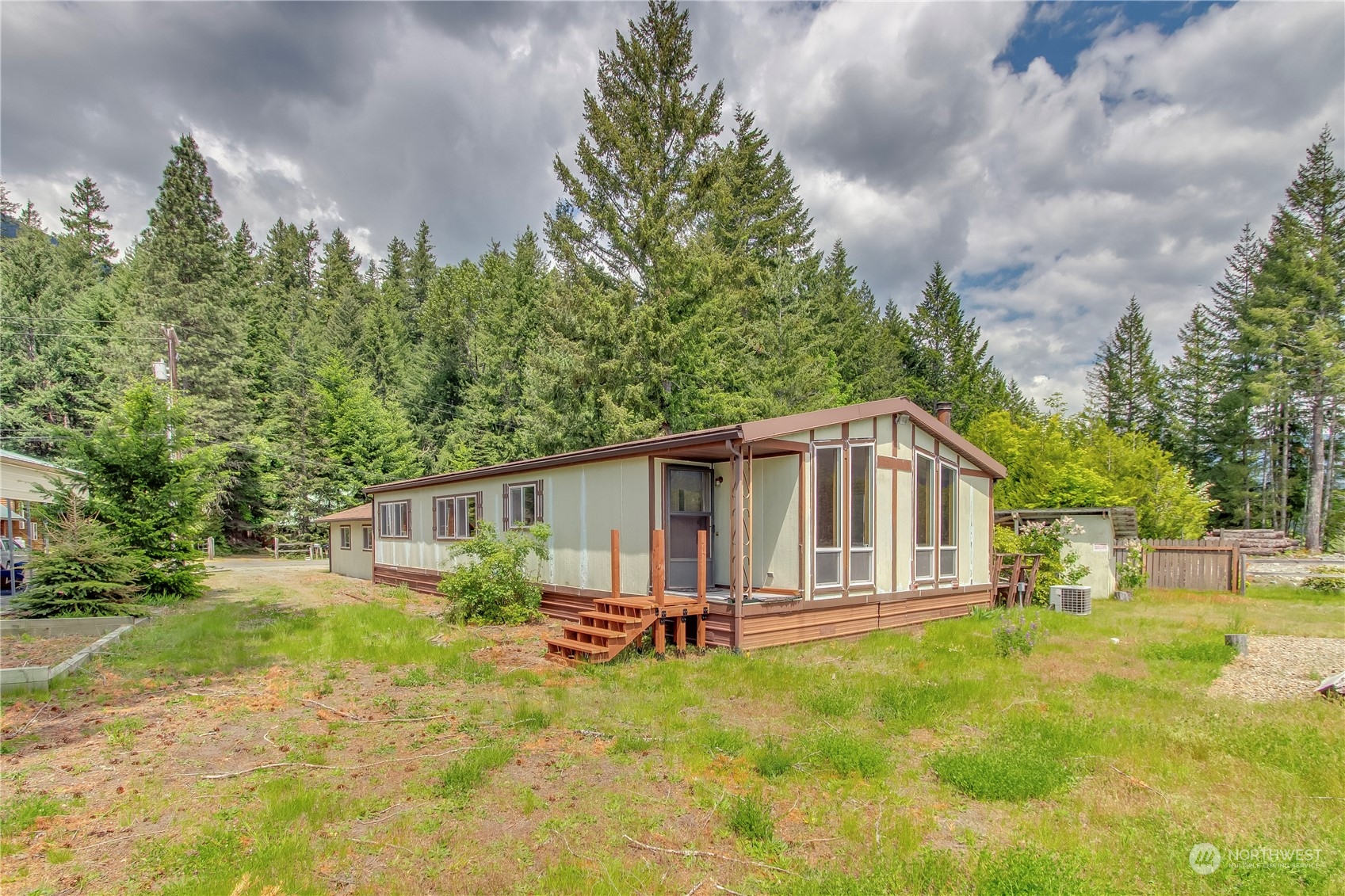 140 Maple Place Packwood, WA 98361 - Photo 5 of 39 a house with trees in the background