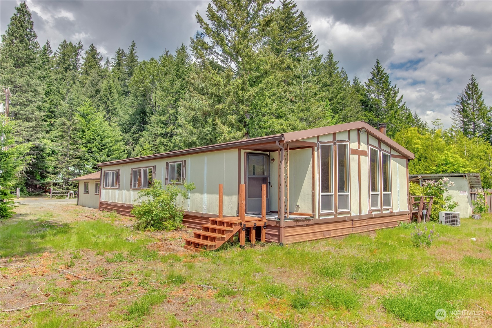 140 Maple Place Packwood, WA 98361 - Photo 6 of 39 a house view with a garden space