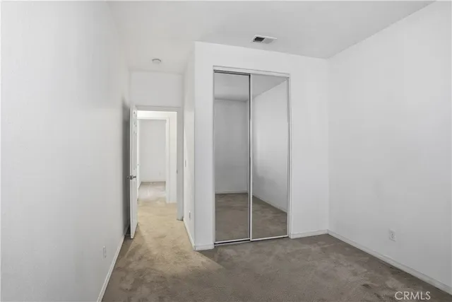 a bathroom with a double vanity sink toilet mirror and shower