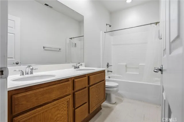 an aerial view of multiple houses with yard