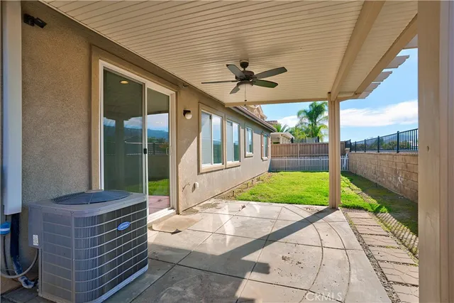 a view of house with backyard and deck