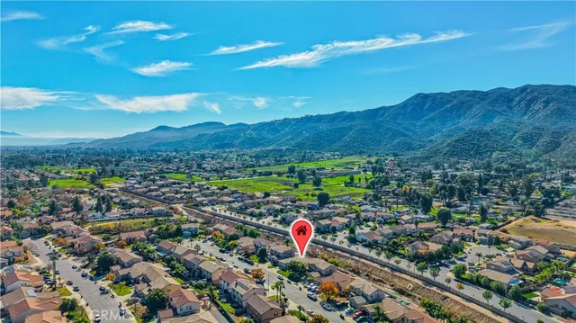 an aerial view of a house with a swimming pool patio and outdoor seating