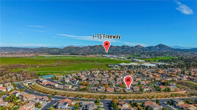 a aerial view of a house with a garden and a yard