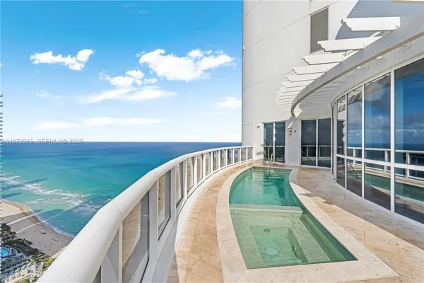 a view of swimming pool with a balcony