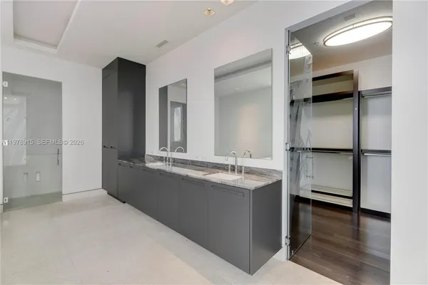 a bathroom with a bath tub and shower
