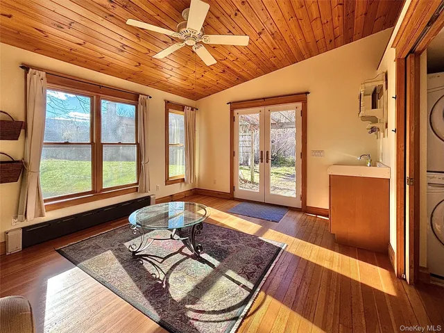 a living room with furniture and a rug