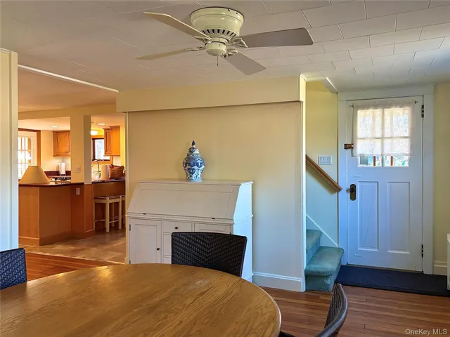 a kitchen with stainless steel appliances granite countertop a refrigerator a stove a sink and a refrigerator