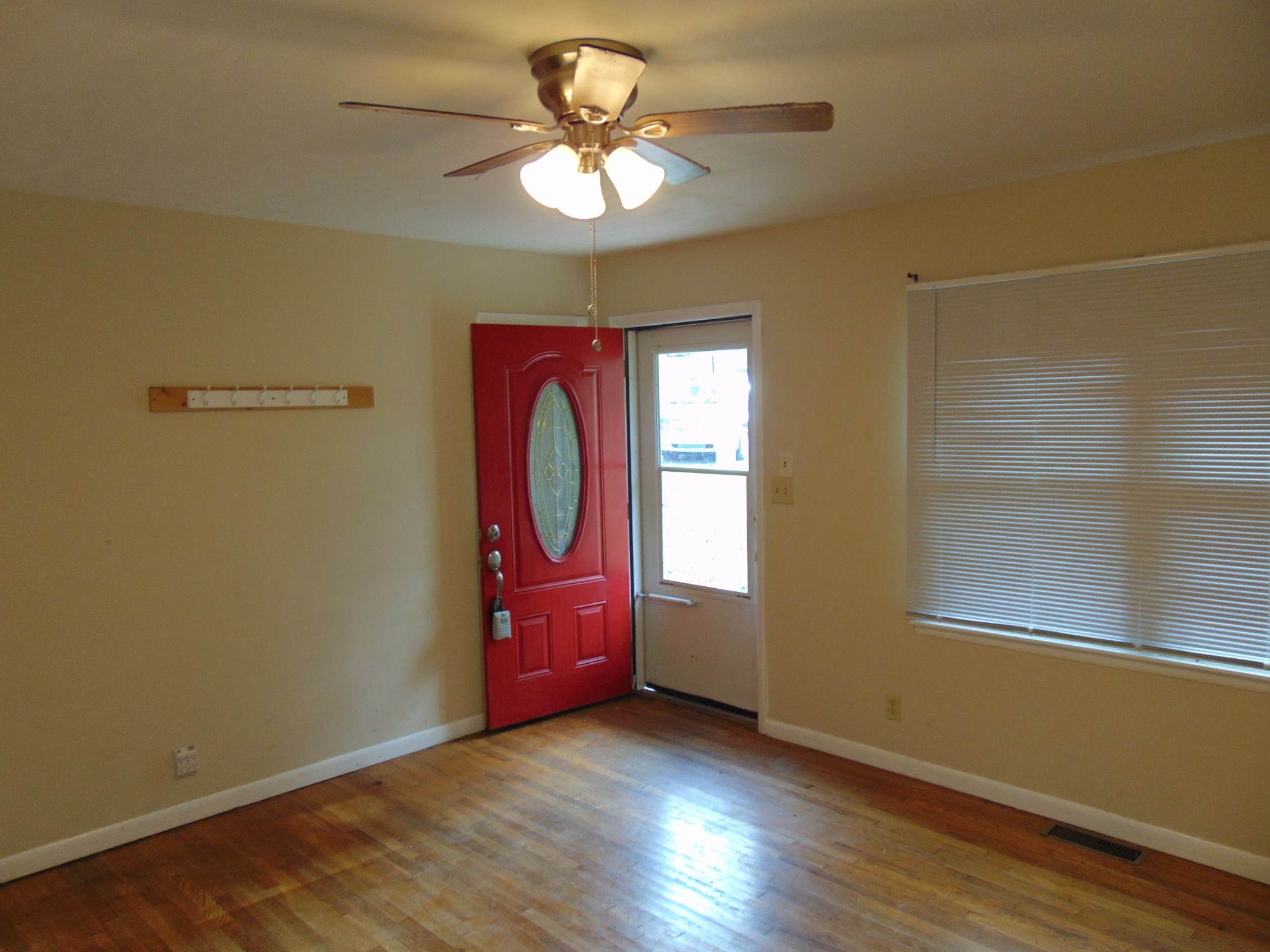 205 Pendergrass Road Flintville, TN 37335 - Photo 3 of 22 wooden floor in an empty room with a window