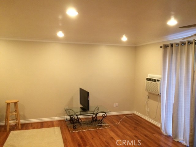 8990 19th Street, Unit 352 Rancho Cucamonga, CA 91701 - Photo 2 of 12 a view of a workspace with furniture and wooden floor