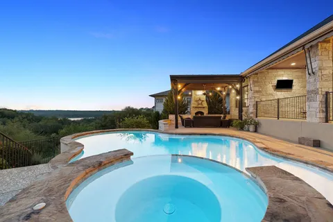 a view of a swimming pool with a patio