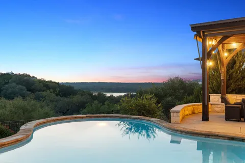 a view of swimming pool with a patio
