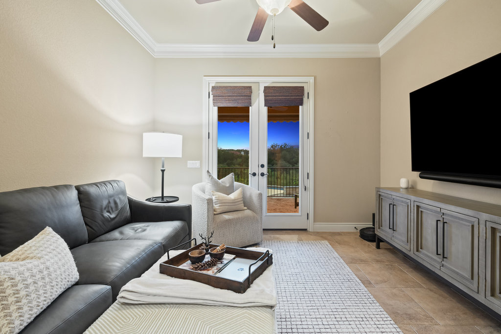 839 Wesley Ridge Drive Spicewood, TX 78669 - Photo 26 of 40 a living room with furniture and a flat screen tv