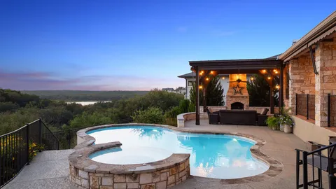 a view of a swimming pool with a patio