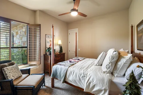 a bedroom with a bed and a couch