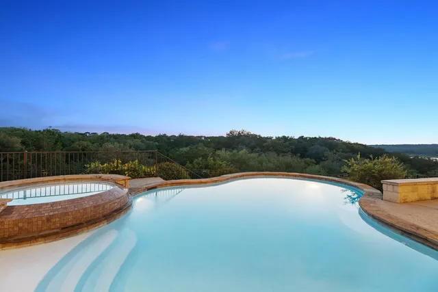 a view of swimming pool with lake view