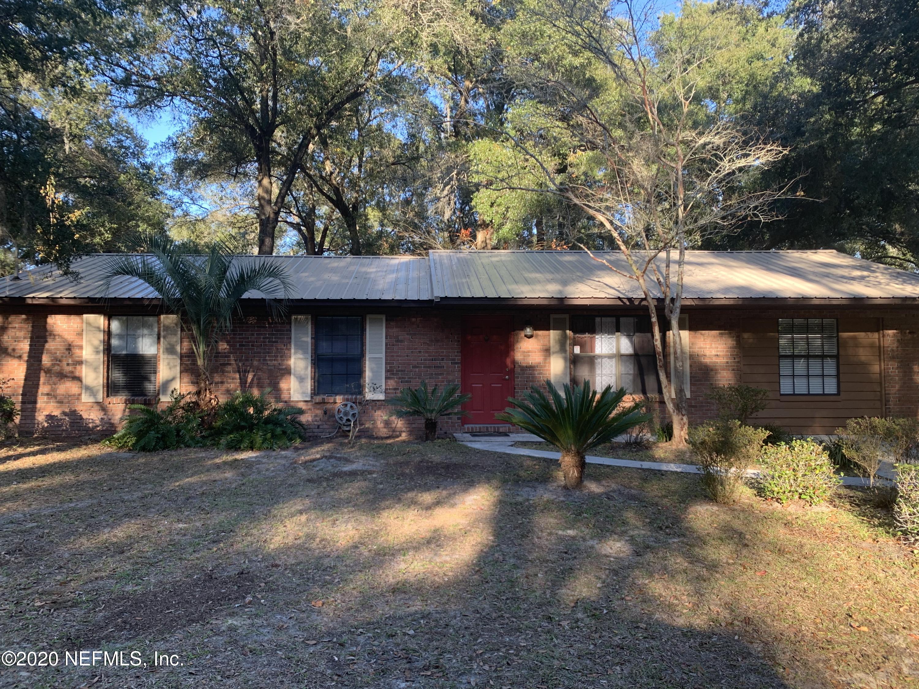 420 Southwest Naha Street Keystone Heights, FL 32656 - Photo 1 of 29 a front view of a house with yard