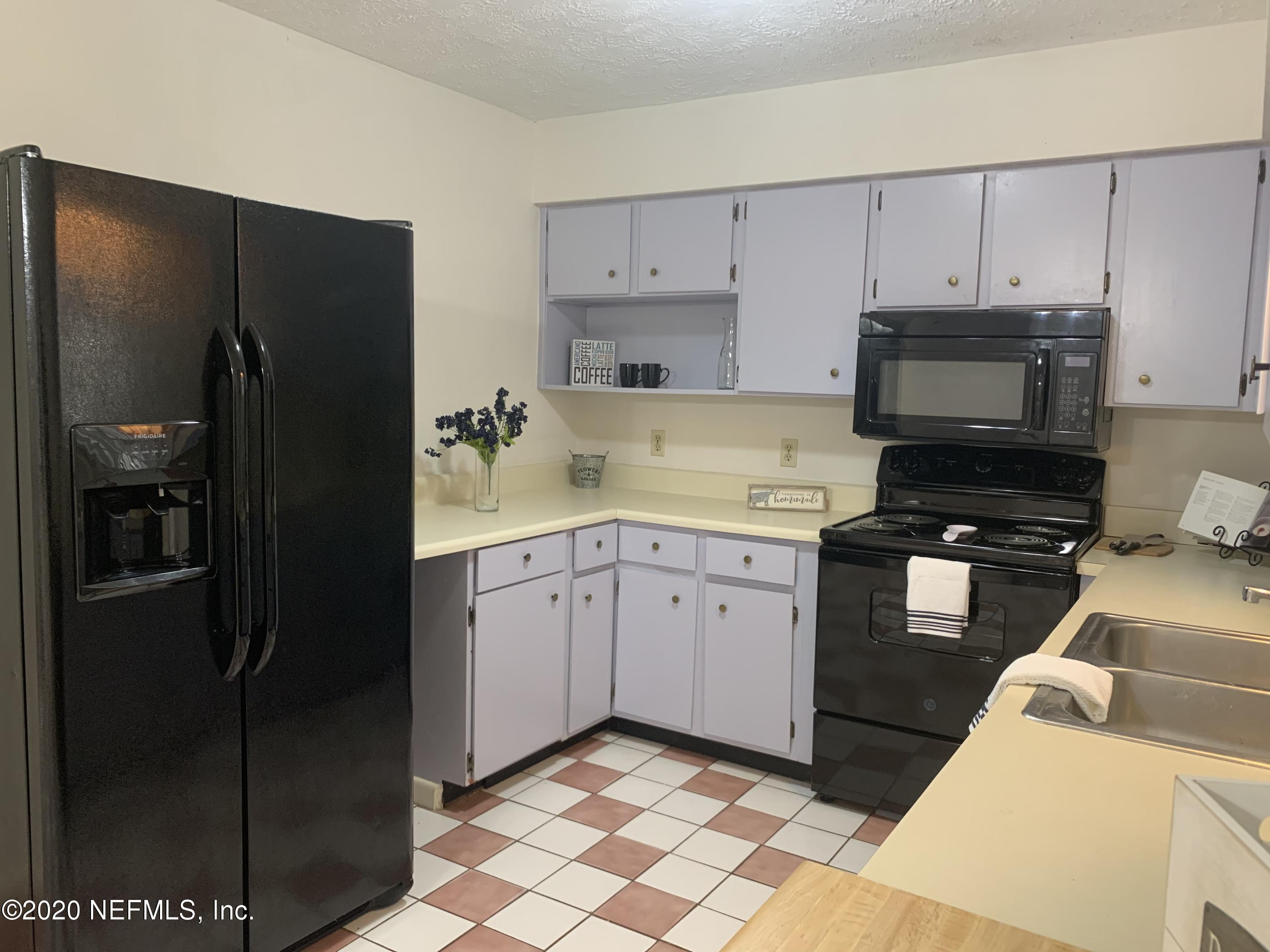 420 Southwest Naha Street Keystone Heights, FL 32656 - Photo 11 of 29 a kitchen with stainless steel appliances granite countertop a refrigerator and a stove top oven
