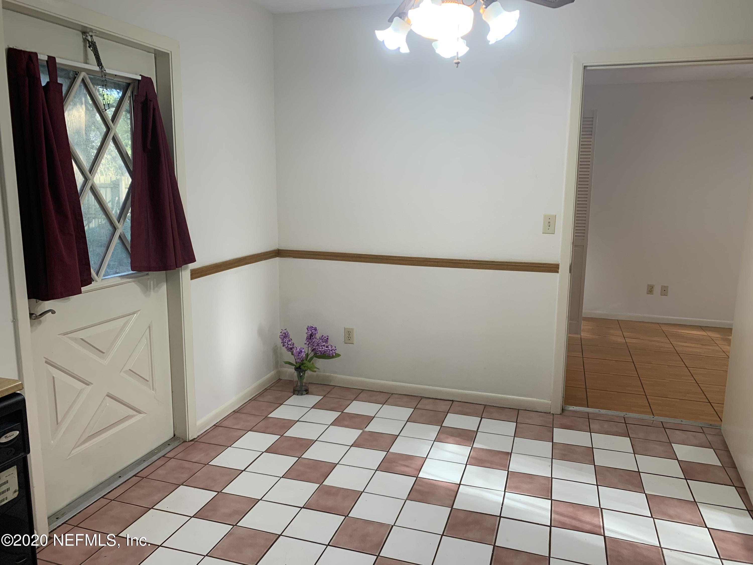 420 Southwest Naha Street Keystone Heights, FL 32656 - Photo 14 of 29 a view of a bedroom with wooden floor and windows