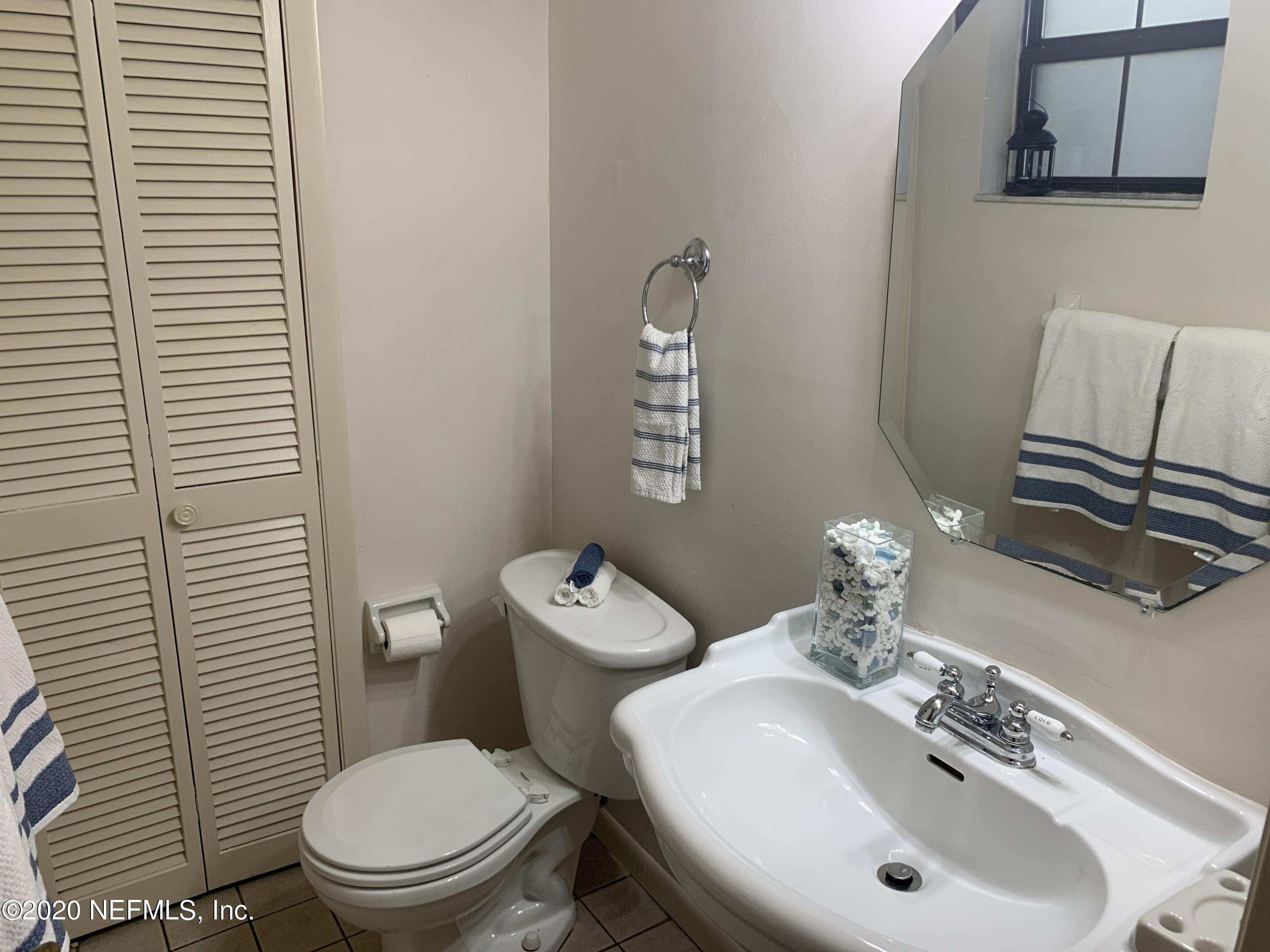 420 Southwest Naha Street Keystone Heights, FL 32656 - Photo 21 of 29 a bathroom with a sink a toilet and mirror