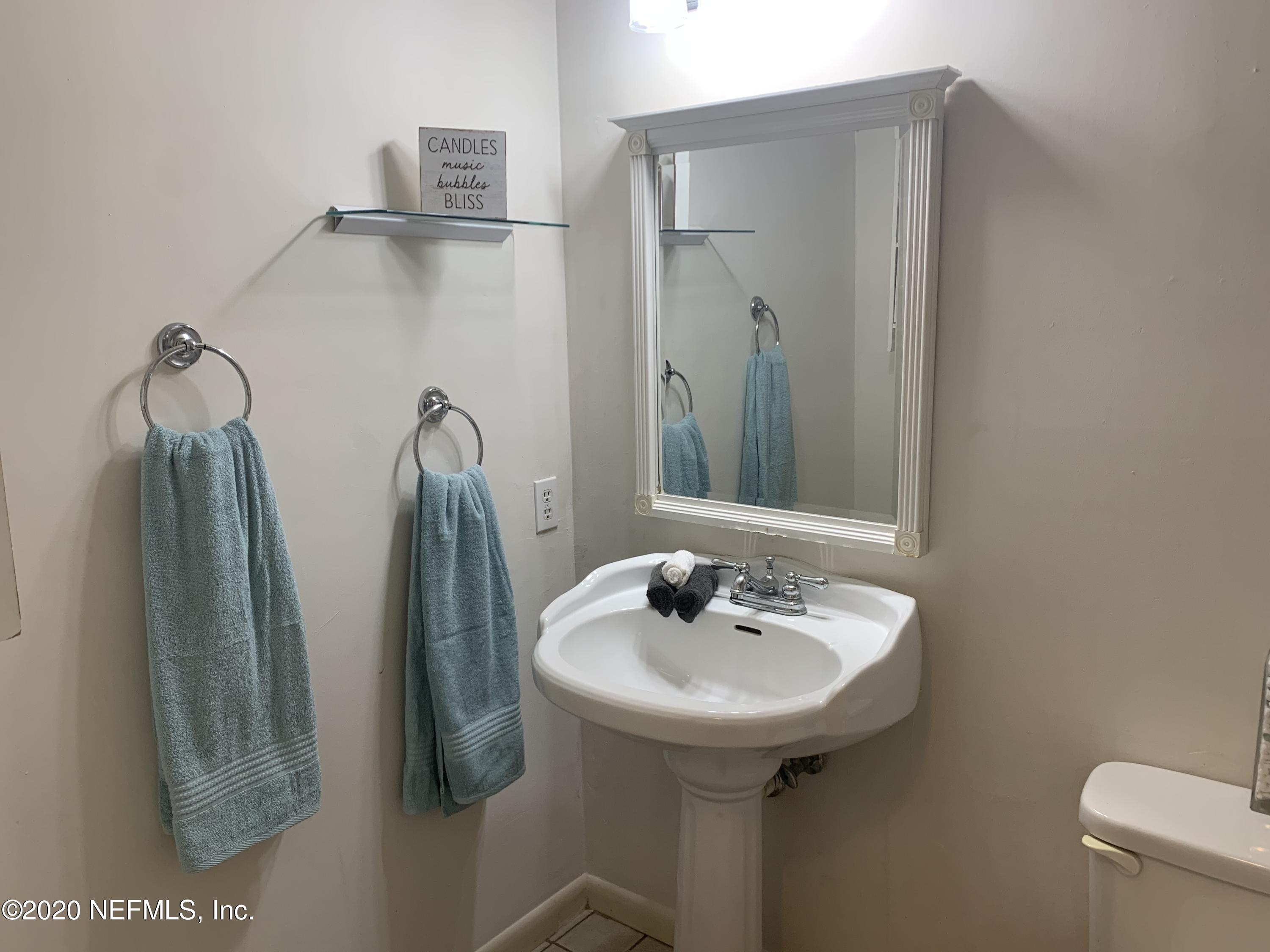 420 Southwest Naha Street Keystone Heights, FL 32656 - Photo 25 of 29 a bathroom with a sink and mirror