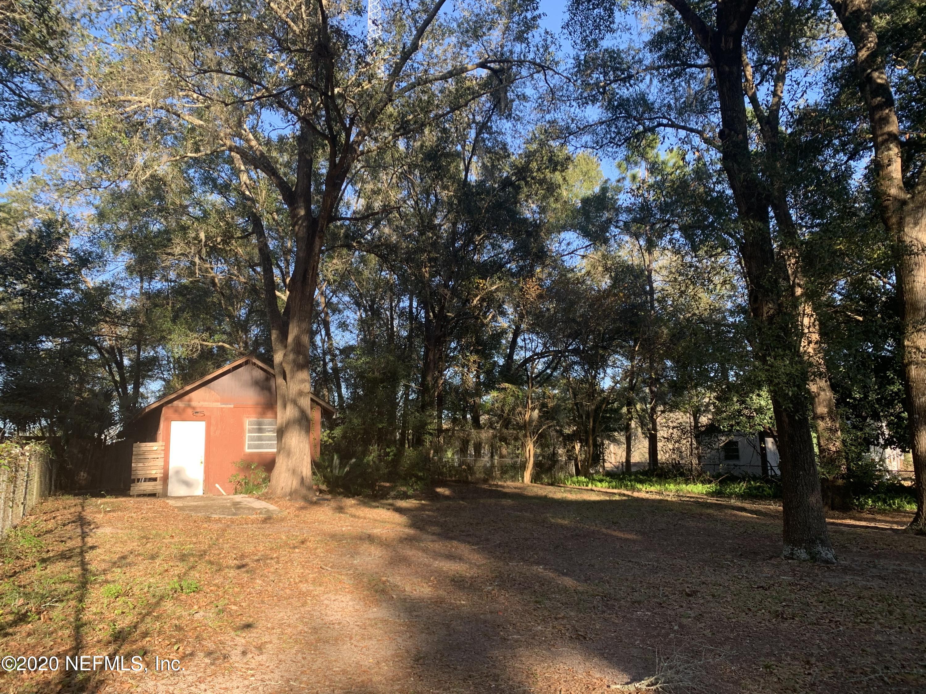 420 Southwest Naha Street Keystone Heights, FL 32656 - Photo 28 of 29 a view of large tree in front of a house
