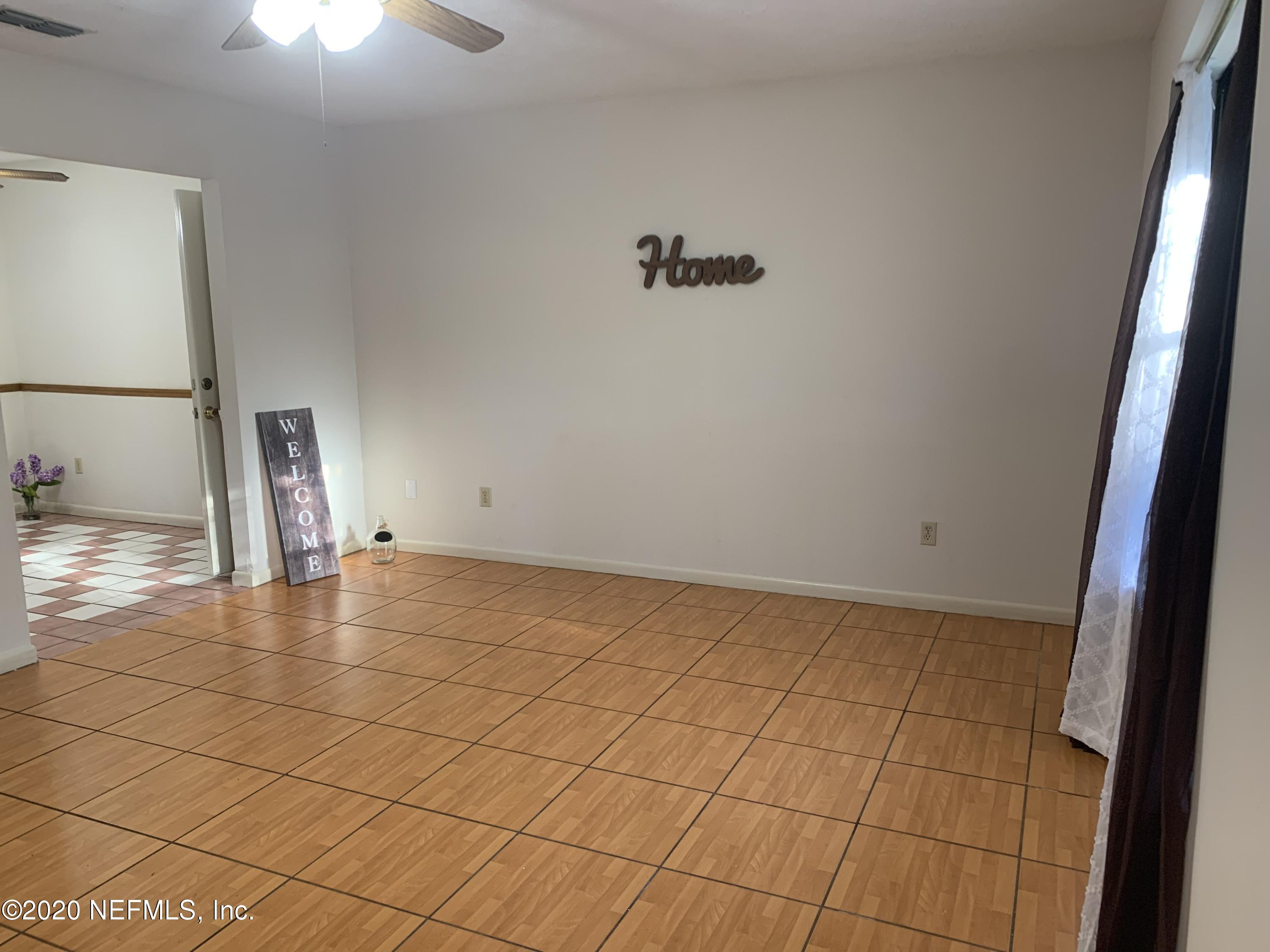 420 Southwest Naha Street Keystone Heights, FL 32656 - Photo 6 of 29 a view of an empty room with a window