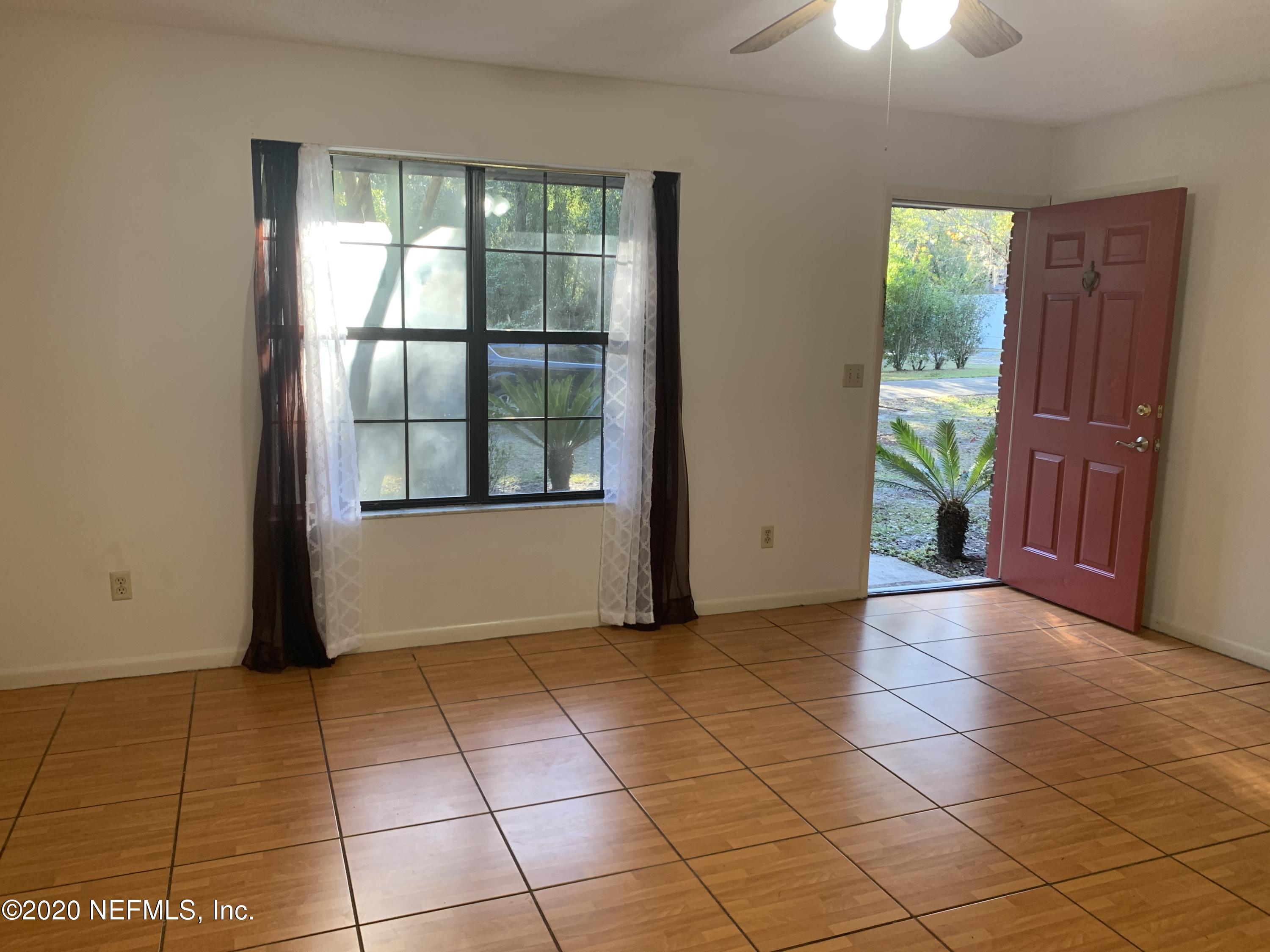 420 Southwest Naha Street Keystone Heights, FL 32656 - Photo 8 of 29 wooden floor in an empty room with a window