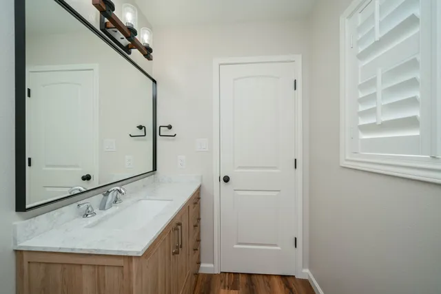 a bathroom with a sink and a mirror