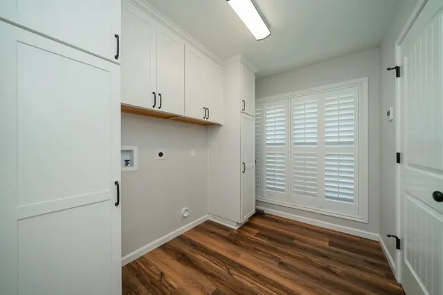 a view of room with hardwood floor and window