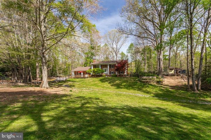 37352 Asher Road Mechanicsville, MD 20659 - Photo 8 of 11 a swimming pool with outdoor seating and yard