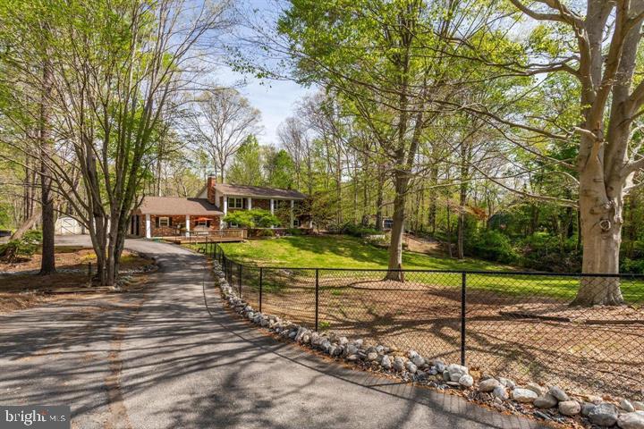 37352 Asher Road Mechanicsville, MD 20659 - Photo 9 of 11 a view of a house with backyard and a tree