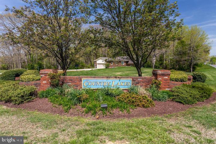 37352 Asher Road Mechanicsville, MD 20659 - Photo 10 of 11 a view of a garden with plants and large trees