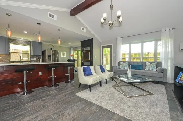 a living room with furniture and a large window