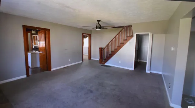 a view of a hallway with staircase
