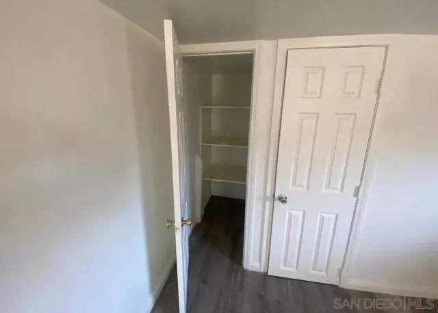 an entryway with wooden floor