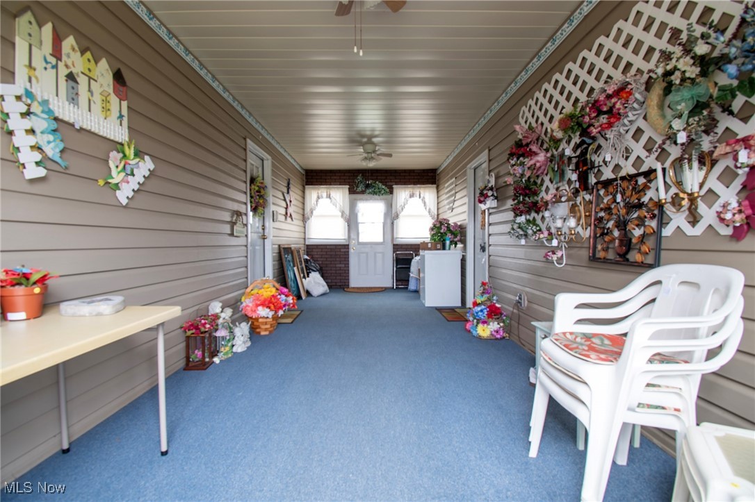 65525 Larrick Ridge Road Cambridge, OH 43725 - Photo 26 of 40 Enclosed breezeway, cool and comfy in the summer. Great place for entertaining neighbors