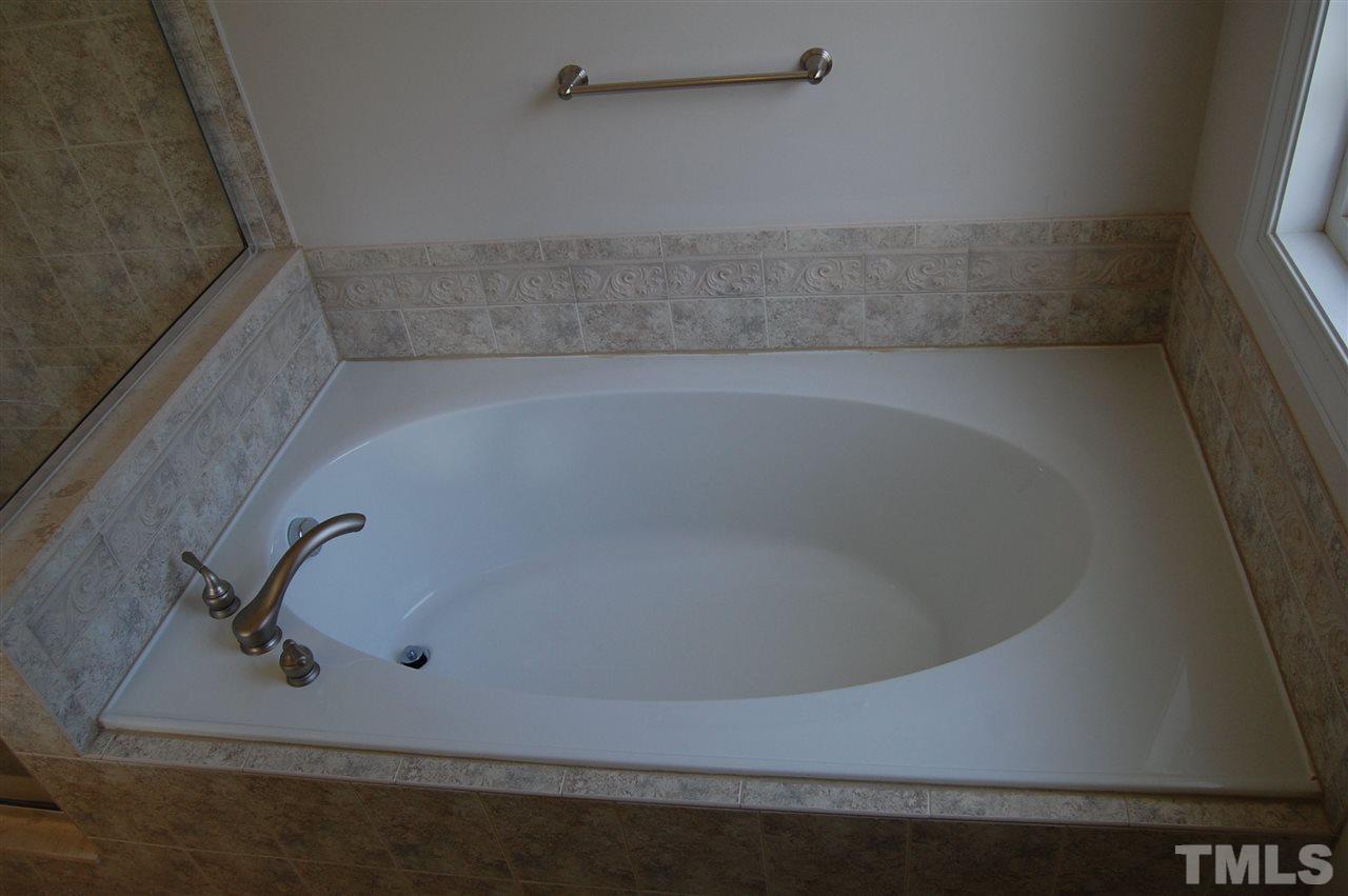 840 Nowell Ridge Road Raleigh, NC 27607 - Photo 14 of 25 MBA Garden tub close up view showing tub, tile work & fixtures!