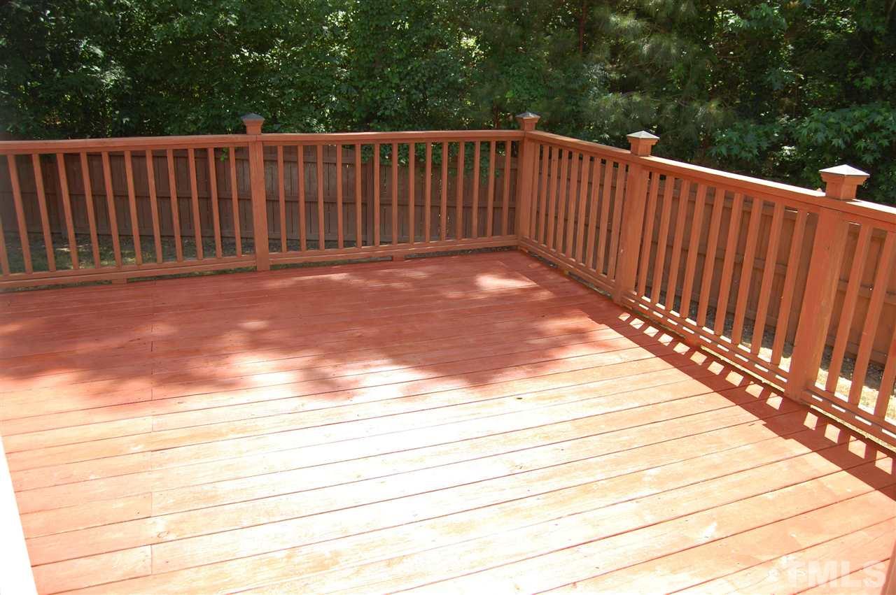 840 Nowell Ridge Road Raleigh, NC 27607 - Photo 22 of 25 Back Deck w/post caps, power washed and stained in 2015 & look at that fenced in yard & privacy!