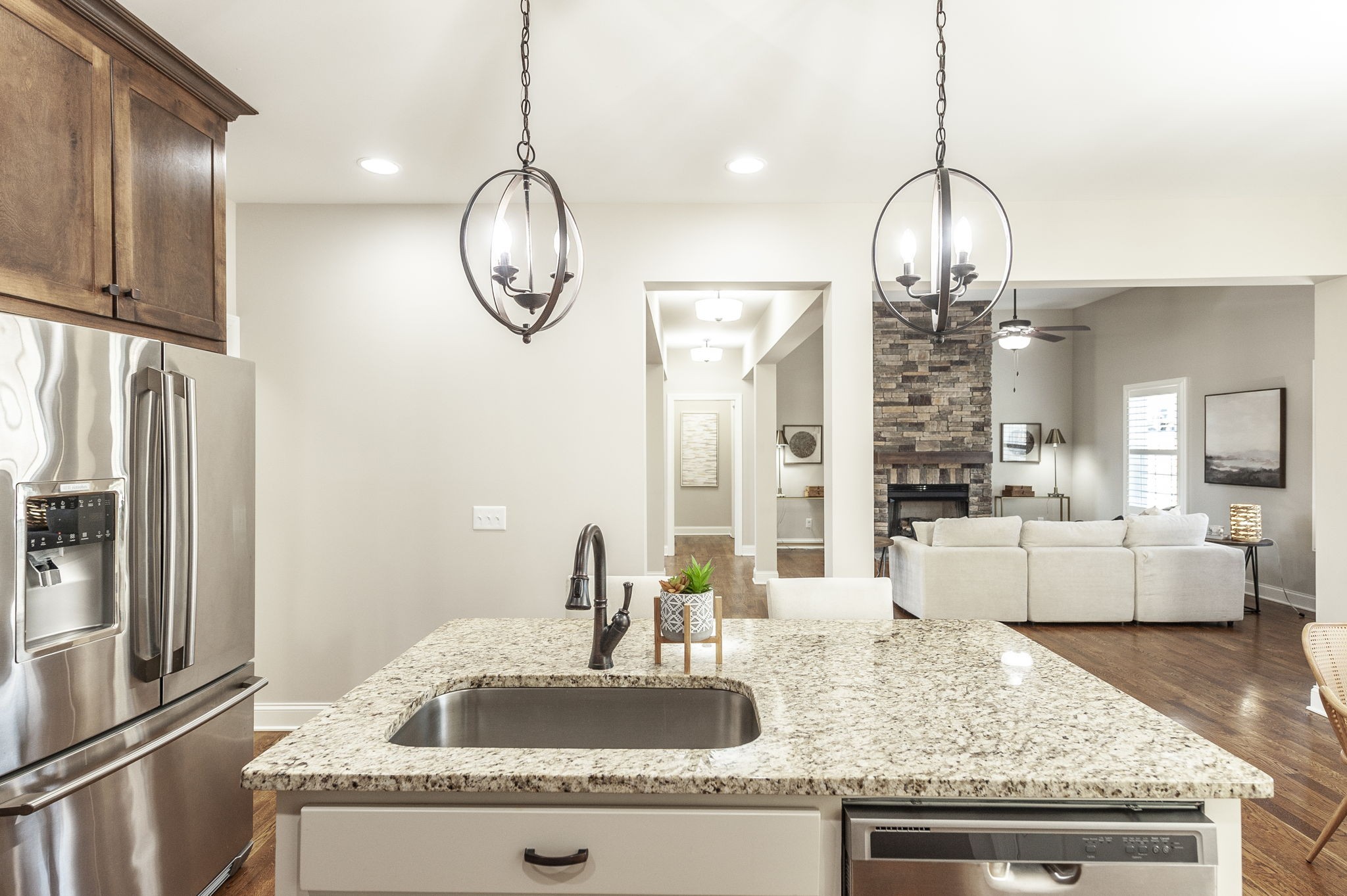 5563 Stacy Springs Road Springfield, TN 37172 - Photo 25 of 73 a kitchen with kitchen island granite countertop a sink stainless steel appliances and a chandelier