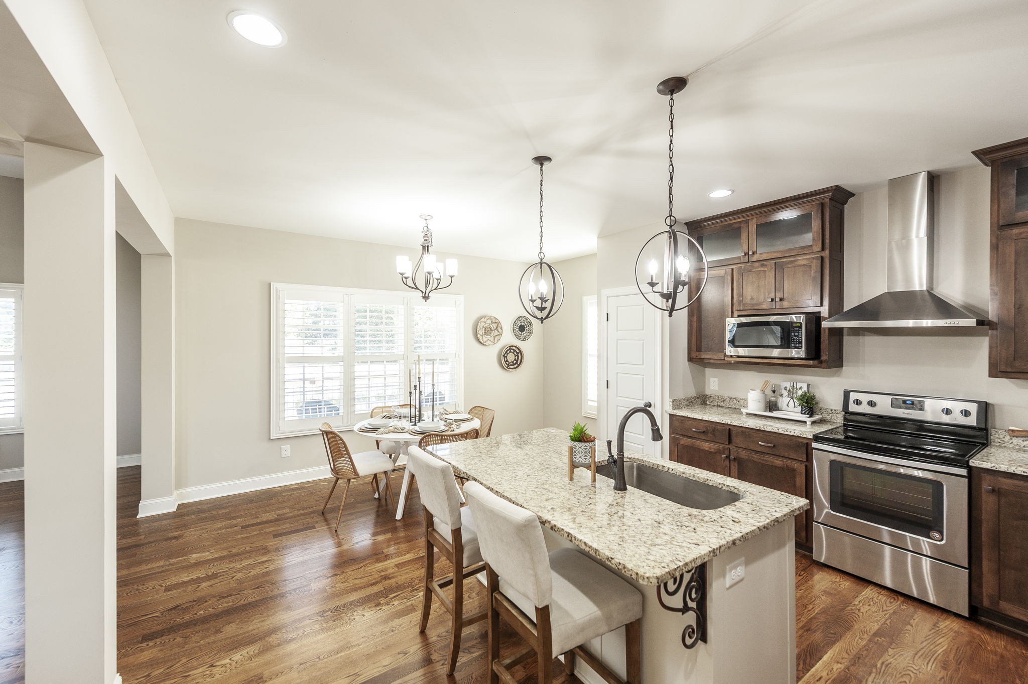 5563 Stacy Springs Road Springfield, TN 37172 - Photo 27 of 73 a kitchen with stainless steel appliances granite countertop a sink a stove and chairs