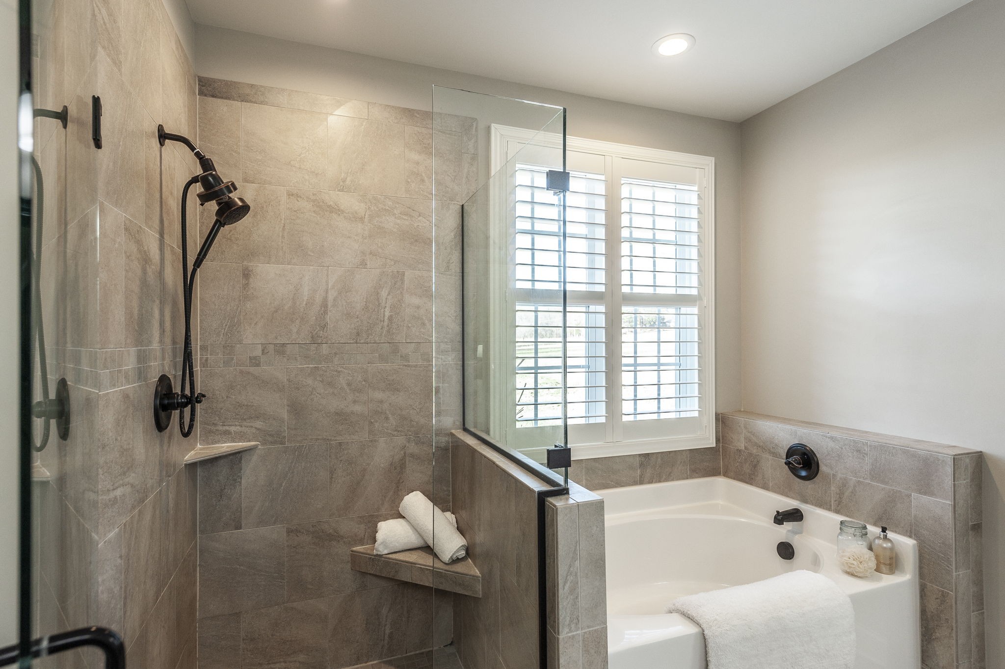 5563 Stacy Springs Road Springfield, TN 37172 - Photo 35 of 73 a bathroom with a bathtub a window and a shower