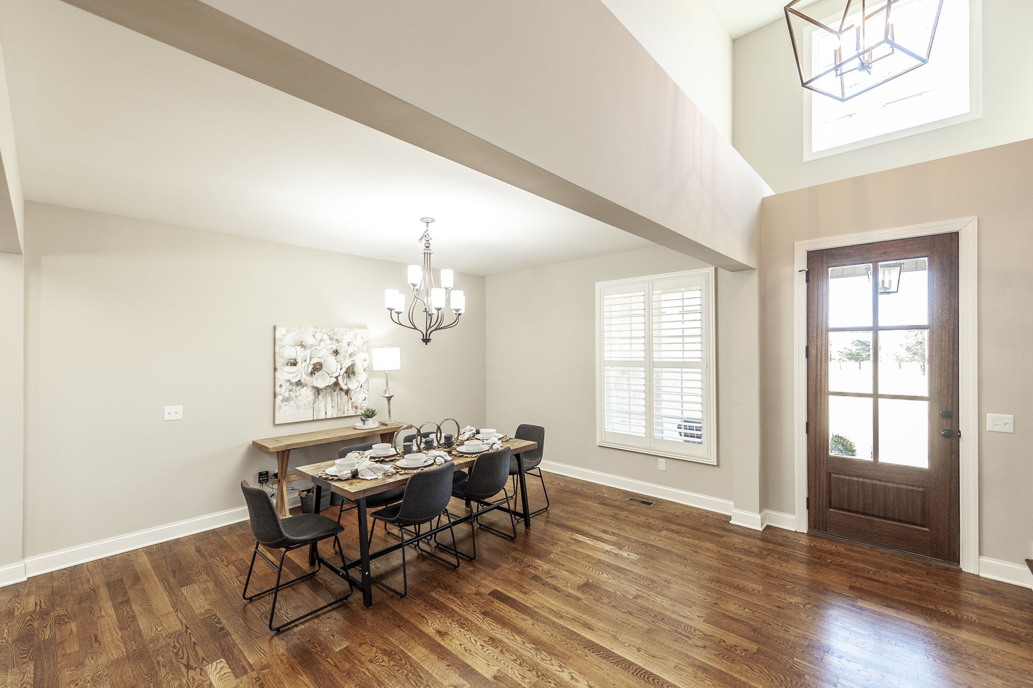 5563 Stacy Springs Road Springfield, TN 37172 - Photo 9 of 73 a dining room with chandelier and wooden floor